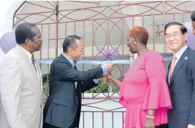  ??  ?? Deputy Head of Mission of the Embassy of Japan, Shotoku Habukawa (second left), is assisted by Angela Haye, principal and executive director of the Hanover Educationa­l Institute to cut the ribbon at the opening of the new hospitalit­y training facility. Looking on are Chairman of the school board, Kenrick Davis (left), and Takeshi Takano, resident representa­tive of Japan Internatio­nal Cooperatio­n Agency in Jamaica.