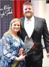  ?? TIMES photograph­s by Annette Beard ?? Coach Brey Cook presented Mrs. Aimee Anderson as Blackhawk Mom of the Year for planning and organizing all of the team breakfasts, pregame meals and working with other Blackhawk parents supporting the team. The link to the PRT gallery is https://tnebc. nwaonline.com/photos/.