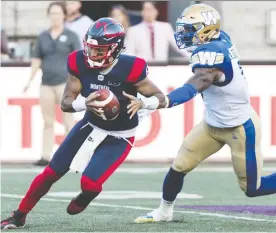  ?? GRaHAM HUGHES/THE CANADIAN PRESS ?? Montreal Alouettes quarterbac­k Vernon Adams Jr., left, breaks away from Winnipeg Blue Bombers linebacker Adam Bighill during second half CFL football action in Montreal on Saturday. Adams tossed two TDs in the final minutes of the game for a Montreal win.