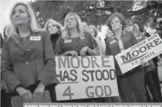  ??  ?? ALABAMA: Women attend a ‘Women For Moore’ rally in support of Republican candidate for US Senate Judge Roy Moore, in front of the Alabama State Capitol in Montgomery, Alabama. —AFP