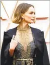  ?? Jay L. Clendenin Los Angeles Times ?? NATALIE PORTMAN’S cape made an activist statement at the 92nd Academy Awards.