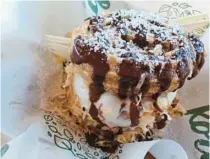  ?? SENTINEL AMY DREW THOMPSON/ORLANDO ?? Feeling dessert? Korgette’s Churro Ice Cream Sandwich — fresh fried with superb coconut ice cream from local maker Natural Goodness — is one no one visiting A La Cart should miss.