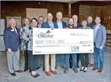  ?? Janelle Jessen/Siloam Sunday ?? Cox Communicat­ions donated $20,000 to the Siloam Springs Chamber of Commerce on Dec. 19 to fund a maker space. Pictured are Wayne Mays (left), retiring president and CEO of the Chamber of Commerce; Cheri Harrison, Cox media consultant; Angela DeLille, Cox manager of government affairs; Tim McCord, market president for Generation­s Bank and past Chamber board chair; Curt Stamp, Cox vice president of government affairs; James Barnett, CEO of DaySpring and Chamber board member; Nathan Reed, Chamber vice president; Phillip Patterson, city administra­tor; Whitney Yoder, Cox manager of public affairs; Reid Carroll, city board member; and Tyler Dees, current Chamber board chair.