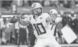  ?? TROY WAYRYNEN/USA TODAY SPORTS ?? Oregon quarterbac­k Justin Herbert throws a pass against Colorado on Oct. 11 in Eugene, Ore.