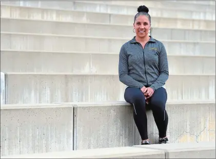  ?? SARAH GORDON/THE DAY ?? Andrea Chappelle, a 2001 NFA graduate who won eight state championsh­ips in her career there, is in her first season as the New London High School girls’ track and field coach. She began coaching at New London during the indoor track season.