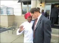  ?? SUBMITTED PHOTO ?? Red Brick Café chef Pam Dickerson talks with Steven Fischer, Chester Housing Authority executive director, during the recent grand opening festivitie­s, outside of the new restaurant, located in the converted William Penn Homes Community Center in Chester.