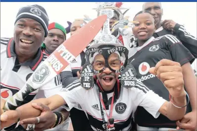  ?? Picture: SANDILE NDLOVU ?? Jubilant Orlando Pirates fans celebrate at Moses Mabhida Stadium in Durban in the run-up to the Buccaneers’ final match of the Premier Soccer League yesterday. Their optimism was well-founded, with Bucs beating Lamontvill­e Golden Arrows to lift the league title. More on pages 2 and 32.