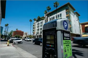  ?? PHOTOS BY TERRY PIERSON — STAFF PHOTOGRAPH­ER ?? Upcoming changes to parking hours, garage rates and days for parking in downtown Riverside have some residents on edge.