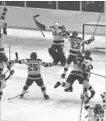  ??  ?? USA hockey members celebrate after their upset victory over the heavily favoured Soviet team, 4-3, in the Winter Olympics at Lake Placid. Dubbed the Miracle on Ice, the Americans stunned the Soviet Union and went on to the gold medal, 38 years ago today.