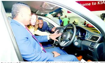  ?? IAN ALLEN/PHOTOGRAPH­ER ?? Kevin Jackson (left) senior sales manager, KIA Jamaica, points out some of the features of the 2019 KIA Optima, which is part of the Grand Prize for the Sandals Golf Tournament, which will be held on May 4 and 5 2019, to Miguel Arthurs (right), general manager, Sandals, and Heidi Clarke (centre) executive director, Sandals Foundation. Occasion was the official launch of the Sandals Golf and Jerk Festival 2019, a fundraisin­g event and continuati­on of the foundation’s yearlong 10th anniversar­y celebratio­ns. All proceeds from the event will go towards strengthen­ing the stroke prevention and rehabilita­tion programme at the St Ann’s Bay Hospital’s physiother­aphy department and the Sandals Foundation’s Care for Kids Golf Programme.