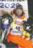  ?? DIANA HAECKER/NOME NUGGET/ REUTERS ?? Norwegian musher Thomas Waerner with his lead dogs K2 and Bark.