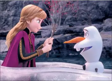  ?? Disney ?? ANNA AND OLAF (voiced by Kristen Bell, Josh Gad) go on an amazing but perilous journey in “Frozen 2.”