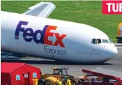  ?? ?? Aftermath: The fire-damaged fuselage in Dakar, left; the FedEx plane after emergency landing; and, right, the Corendon aircraft