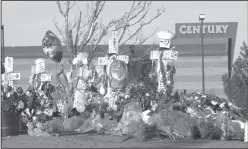  ?? Ted S. Warren/AP ?? Memorial: Crosses are displayed in honor of the victims of the Aurora, Colo., movie theater shooting, which killed 12 people and injured 70. James Holmes was convicted of murder and attempted murder and sentenced to life in prison without parole for the shootings. In a new book and an interview with The Associated Press, psychiatri­st William H. Reid, who spent hours talking with Holmes, says what led Holmes to open fire was a vortex of his mental illness, his personalit­y and his circumstan­ces, along with other, unknown factors.