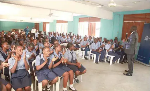  ??  ?? Head General Services FBN Merchant Bank, Segun Adebayo, teaching students on the importance of savings at the Isale-Eko Grammar School in commemorat­ion of World Savings Day