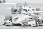  ?? DARRON CUMMINGS/AP ?? Will Power drives his car during the IndyCar Grand Prix auto race at Indianapol­is Motor Speedway on Saturday.
