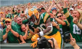  ?? Photograph: Tannen Maury/EPA ?? Green Bay fans celebrate with running back Jamaal Williams during a game last season.