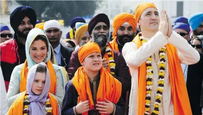  ?? SEAN KILPATRICK/THE CANADIAN PRESS ?? Prime Minister Justin Trudeau, wife Sophie Grégoire, and children at the Golden Temple in India.