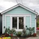  ??  ?? NOW The studio, with original siding that Jelic restored, and a neighbour’s cast-off window in place of the original swinging door.