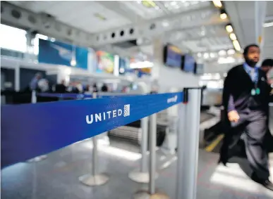  ?? AFP/GETTY IMAGES ?? United Airlines suffered a storm of criticism when airport police officers physically removed passenger Dr. David Dao from his seat and dragged him off the airplane, after he was asked and refused to give up his seat for airline crew members.