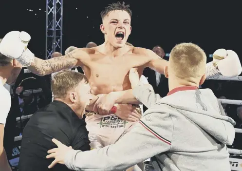  ??  ?? 0 Lee Mcgregor celebrates with his team after beating Kash Farooq on a split decision at the Emirates Arena in Glasgow on Saturday.