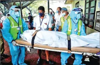  ?? AFP ?? Some 149 people were still in local hospitals after the crash of the special flight from Dubai to bring back Indians stranded by the coronaviru­s pandemic.