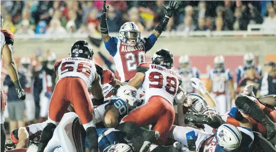  ?? GRAHAM HUGHES/THE CANADIAN PRESS ?? Tyrell Sutton celebrates an Als touchdown against Calgary on Friday. He suffered a calf contusion and will not start at tailback on Wednesday.