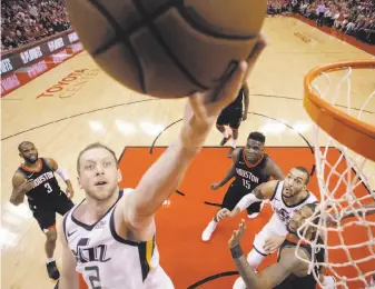  ?? Eric Christian Smith / Associated Press ?? Utah forward Joe Ingles drives to the basket during the first half of the Jazz’s Game 2 win over Houston. Ingles scored a career-high 27 points as the Jazz tied the series 1-1.