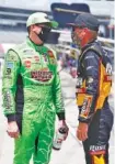 ?? AP PHOTO/RAY CARLIN ?? NASCAR drivers Kyle Busch, left, and Clint Bowyer talk on pit road at Texas Motor Speedway before this past Sunday’s Cup Series race in Fort Worth.