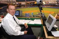  ?? The Associated Press ?? ■ Baseball announcer Tim McCarver prepares in the press box before the start of Game 2 of the American League Division Series on Oct. 2, 2003, in New York.