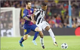  ??  ?? Barcelona’s forward from Argentina Lionel Messi (left), vies with Juventus’ defender from Brazil Alex Sandro during the UEFA Champions League Group D football match FC Barcelona vs Juventus at the Camp Nou Stadium in Barcelona on Sept 12. (AFP)