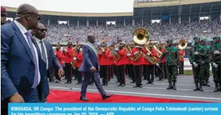  ?? — AFP ?? KINSHASA, DR Congo: The president of the Democratic Republic of Congo Felix Tshisekedi (center) arrives for his investitur­e ceremony on Jan 20, 2024.