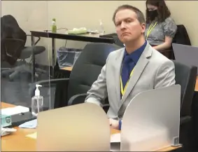  ?? THE ASSOCIATED PRESS ?? In this image from video, former Minneapoli­s police Officer Derek Chauvin listens as his defense attorney Eric Nelson gives closing arguments as Hennepin County Judge Peter Cahill preside Monday, April 19, in the trial of Chauvin at the Hennepin County Courthouse in Minneapoli­s.