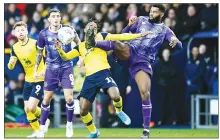  ??  ?? FOUL: Charlton defender Adedeji Oshilaja kicks Oxford midfielder Tarique Fosu-Henry in the face