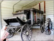  ??  ?? Left: Don Carte of Lincoln drives an Oliver Row Crop 77 in the parade of power at the Tractor Show and Pull on Nolen Farm in Morrow. Above: One of the antique items at Nolen Farm in Morrow is this horse-drawn hearse, protected in a storage building on the farm property.