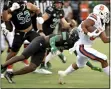  ?? N. SCOTT TRIMBLE — THE POST-STANDARD VIA AP ?? Syracuse running back Sean Tucker (34) evades Ohio defenders during an NCAA college football game, Saturday, Sept. 4, 2021, in Syracuse, N.Y.