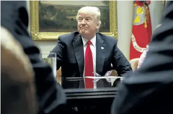  ?? EVAN VUCCI/THE ASSOCIATED PRESS ?? U.S. President Donald Trump is seen during a meeting with the National Associatio­n of Manufactur­ers on Friday. Trump is facing new questions about interferen­ce in the investigat­ions into Russian meddling during the election.