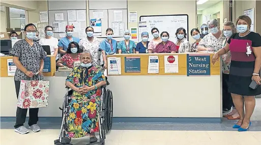  ?? SCARBOROUG­H HEALTH NETWORK PHOTO ?? After more than two months battling COVID-19, Surujdai Sawh, seated above, was discharged from the Scarboroug­h Health Network’s Centenary campus on July 17.