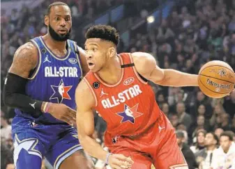  ?? JOHN J. KIM/CHICAGO TRIBUNE ?? LeBron James, left, said having an All-Star Game this season is a “slap in the face,” while Giannis Antetokoun­mpo said “I don’t want to do it.”