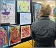  ?? Picture: SIBONGILE NGALWA ?? COLOURFUL CREATIONS: A visitor admires primary school artwork at the Belgravia art centre