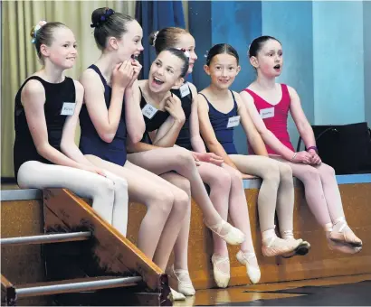  ?? PHOTO: STEPHEN JAQUIERY ?? Chance of a lifetime . . . Ballerinas in waiting (from left) Mia Waite (12), of Wanaka, Isabel Martin (11), of Wanaka, Mia Cohen (13), of Wanaka, Chelsea King (12), of Dunedin, Annabel Harridge (10), of Wanaka, and Bronte Beker (10), of Dunedin, watch the Royal New Zealand Ballet dancers at work during rehearsals at Burns Hall yesterday.