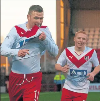  ??  ?? BADGE WORK: Striker Bryan Prunty kisses the club badge, but Airdrieoni­ans were forced to ditch historic crest.