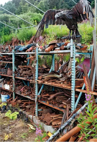  ??  ?? Against the majestic Highland landscape, the russet outline of Elvis the bull still makes an impact (above left). A bird of prey, its feathers in fringed metal, ready to pounce from a shelving post (above right).