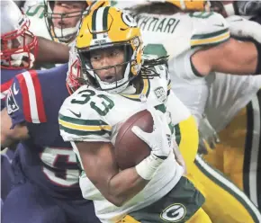  ?? MARK HOFFMAN / MILWAUKEE JOURNAL SENTINEL ?? Packers running back Aaron Jones has never had 20 carries in a game and is averaging 11.2 this season.