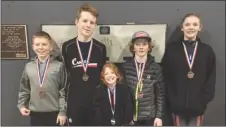  ?? Photo submitted ?? Members of the Kelowna Speed Skating Club, from left, Noah Rubuliak, Jacob Rubuliak, Calla Haaheim, Erik Haaheim and Kenzie Adams show off their medals from the short-track provincial­s in Abbotsford.