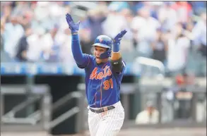  ?? Julio Cortez / Associated Press ?? The Mets’ Carlos Gomez reacts while running the bases after hitting a three-run home run off Nationals relief pitcher Wander Suero during the eighth inning on Thursday.