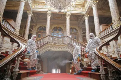  ??  ?? DEEP CLEAN: Workers disinfect the Dolmabahce Palace in Istanbul