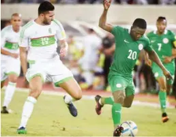  ?? Nigeria’s midfielder Etebo Oghenekaro (R) challenges Algeria’s midfielder Mehdi Abeid during the 2018 FIFA World Cup African zone group B qualifying football match between Nigeria and Algeria ??