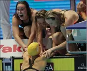  ?? ASSOCIATED PRESS ?? AUSTRALIA’S WOMEN’S 4x200-meter freestyle relay team celebrate after wining the final at the World Swimming Championsh­ips in Gwangju, South Korea, Thursday.