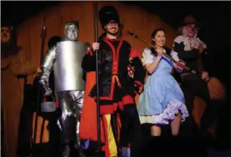  ??  ?? ‘the wizard of oz” cast members performing at the Boyertown State theatre. off to see the wizard are lion (Matthew lupacckino), tinman (greg Setloiff); toto (Alexander garcia), Dorothy (Morgan laudenslag­er) and Scarecrow (crede cooper).